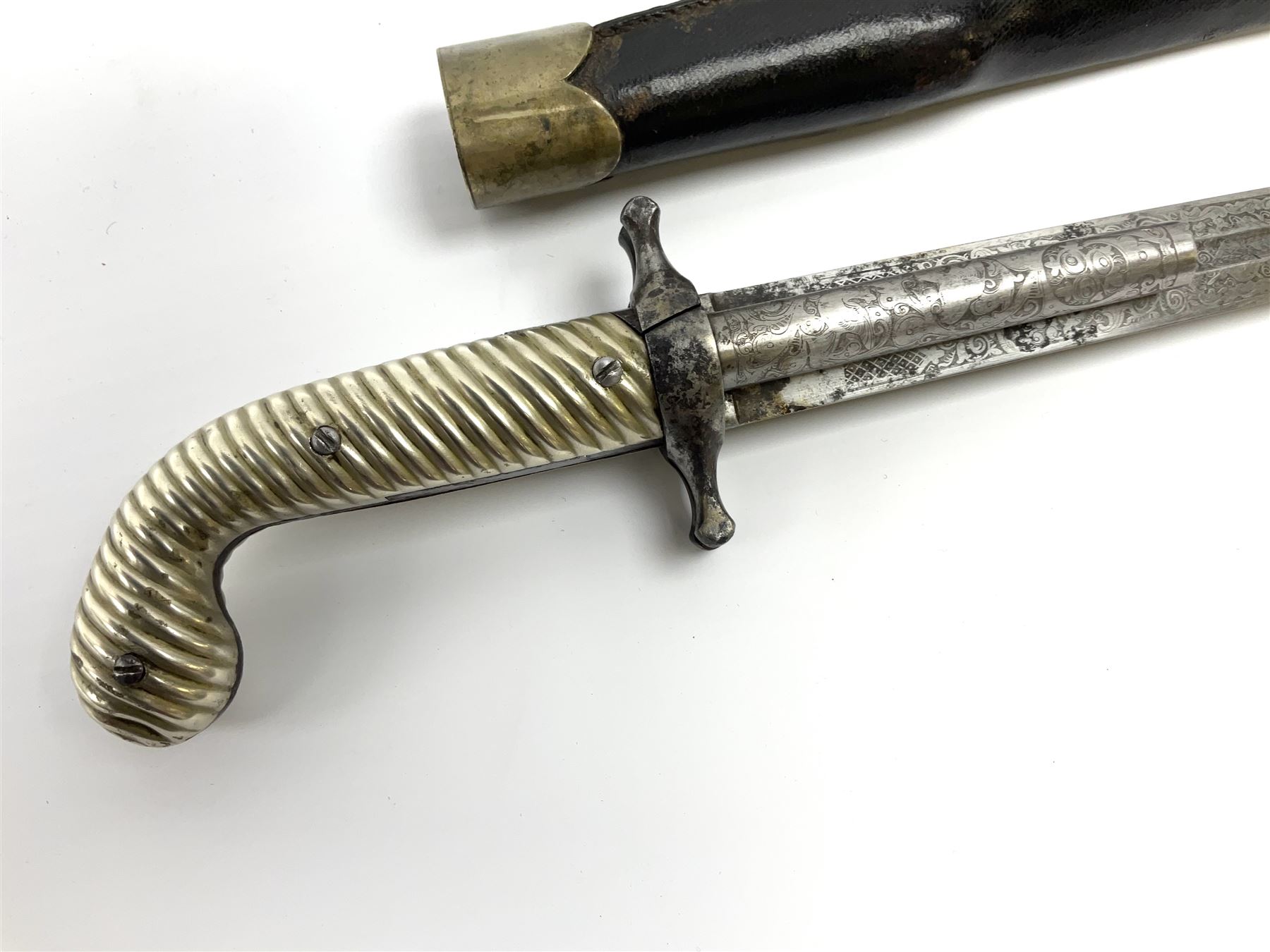 Rare double barrel percussion knife pistol by Dumonthier & Sons (NVN), approx. .38 calibre, with 8.5cm barrels and central 21.5cm spear pointed blade, all with etched damascening, upper quillons serve as hammers for the percussion ignition with single drop down trigger and fluted nickel grips, in nickel mounted leather covered tin scabbard L33.5cm overall