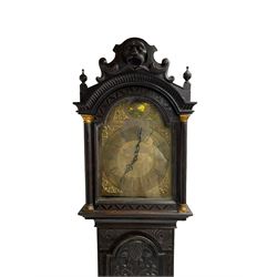 Victorian Jacobean revival oak cased 30 hour longcase clock - with a carved pediment and break arch door beneath, door with attached pilasters and gesso capitals, break arch trunk door with a carved grotesque, conforming carved plinth raised on ball feet, brass dial with spandrels, matted centre and chapter ring, dial pinned to a chain driven countwheel movement, striking the hours on a bell.
With weight and pendulum.