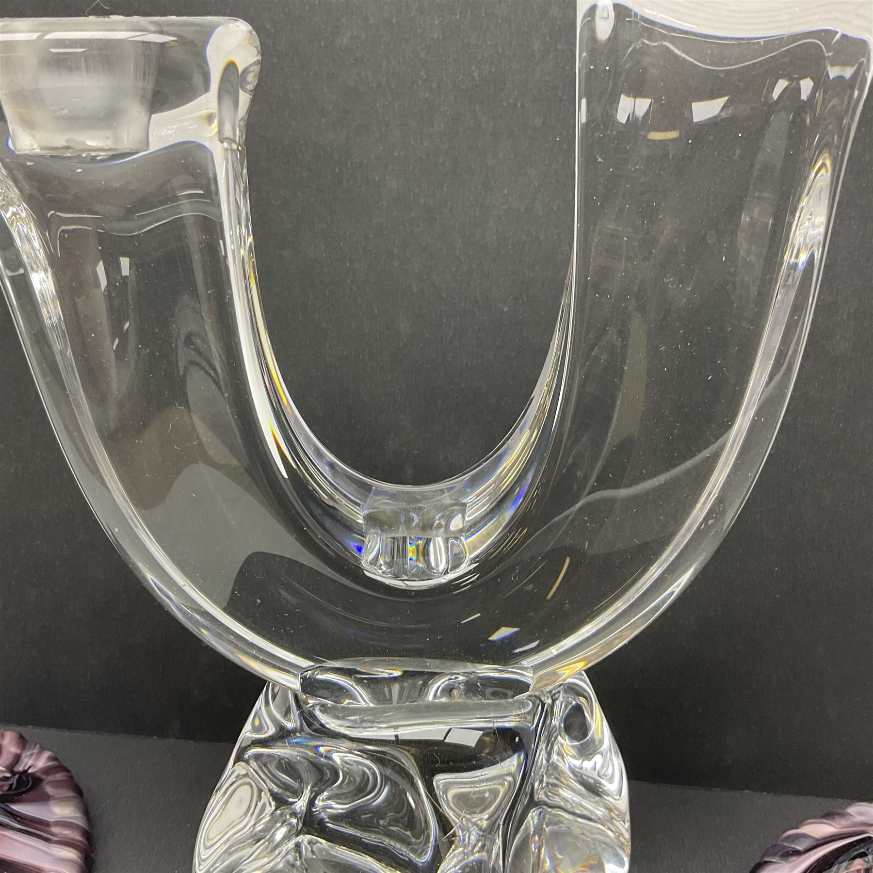 Daum glass two stemmed candle stick signed to verso, together with a pair of slag glass purple candle sticks, Daum H21cm