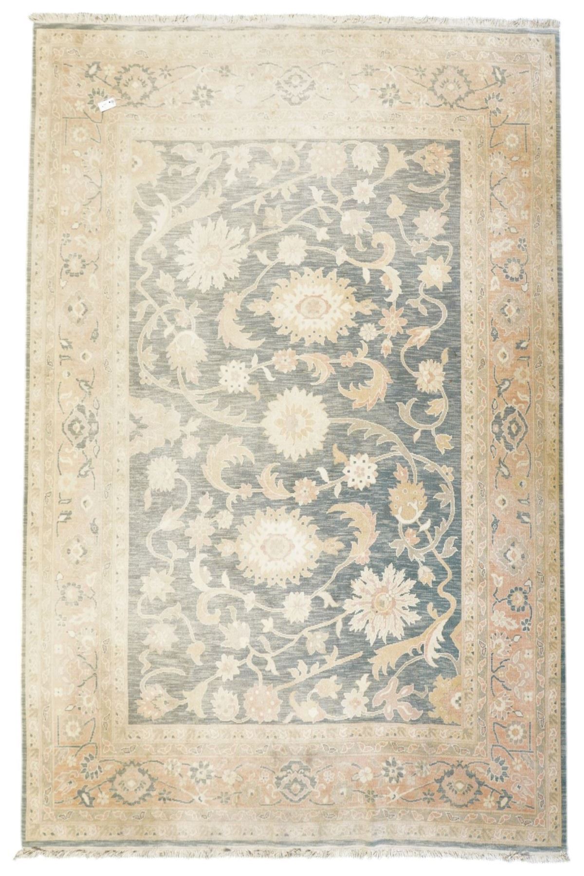 Indo-Persian indigo ground carpet, the field decorated with large palmette motifs connected by scrolling foliate, enclosed nu wide guard bands decorated with repeating interlaced stylised plant motifs