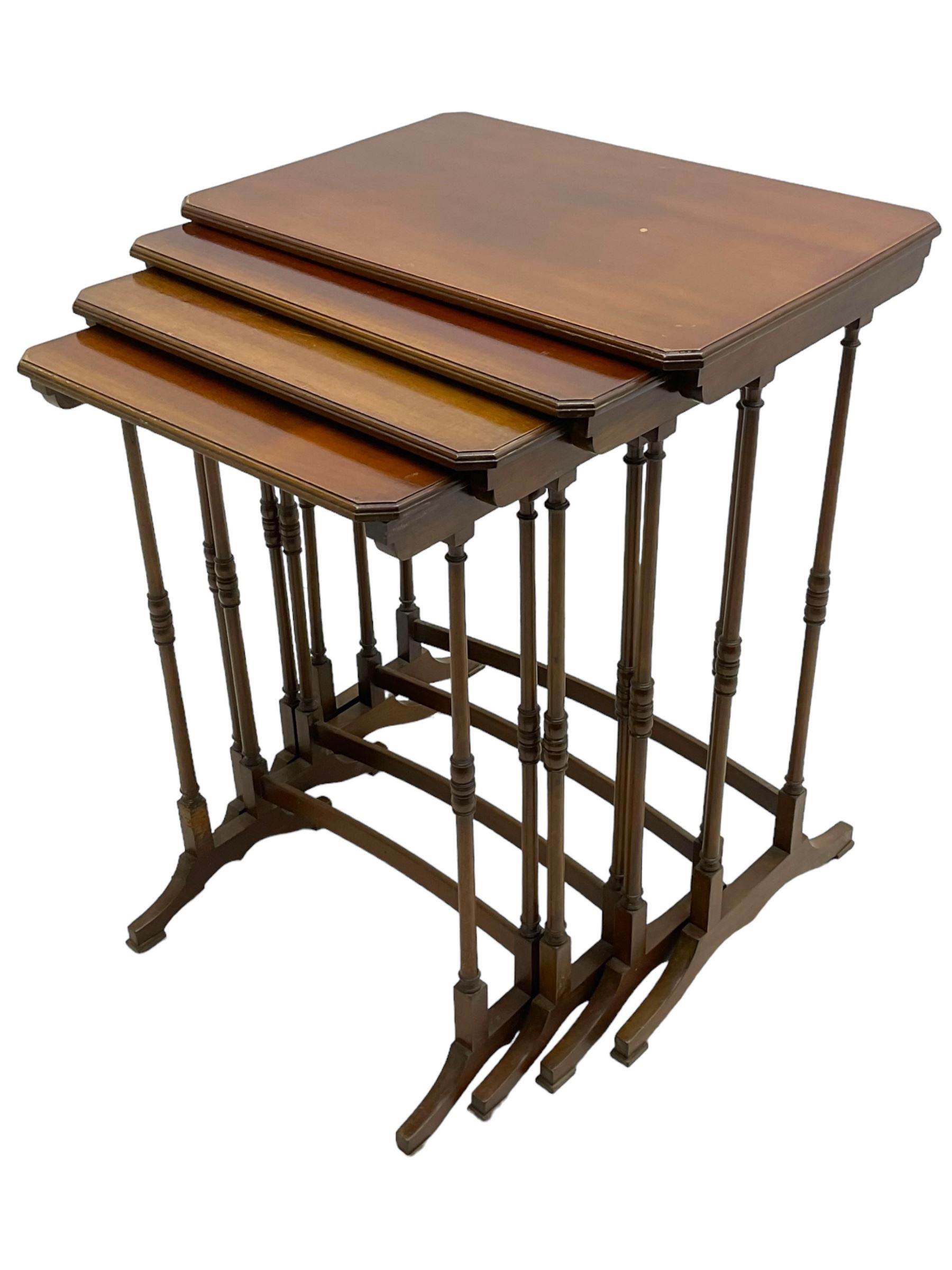 Early 20th century mahogany quartetto nest of four occasional tables, moulded canted rectangular tops on turned supports, on sledge feet