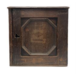 18th century oak spice cabinet, the hinged geometric moulded door opening to reveal a fitted interior with eight drawers, H35.5cm D22cm W36.5cm