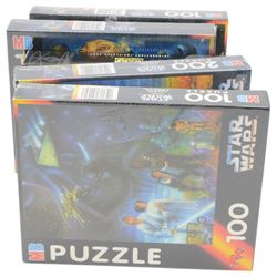 Star Wars puzzles and games, including four sealed MB Games 200piece jigsaw puzzles, two Darth Vader sculpture puzzles, limited edition sealed Ravensburger The Force Awakens Labyrinth game, two Special Edition Star Wars Trilogy Mousemats in original packaging, and a collection of Star Wars The Force Awakens ephemera including tins, flags, 3D glasses, etc
