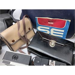 Quantity of Cameras , Lenses and Table Top Viewer- To be assessed 
Collection of cameras, lenses and photography equipment, to include Praktica EE2, Kowa SE, Kodak 66 model II, Inovar, lens Carl Zeiss Jena DDR Flektogon 2.4/35, lens Pentacon Electric f/2.8 135mm, Sunpak auto 2020, tripod  etc, together with a pair of Mark Scheffel 10x50 field binoculars.  