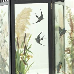Late Victorian Aesthetic Movement ebonised and painted three-panel folding mirror screen, spindle gallery cresting rail over three rectangular mirror plates painted with floral pond scenes with lily-pads, swallows and kingfishers, each panel W37cm H110cm)