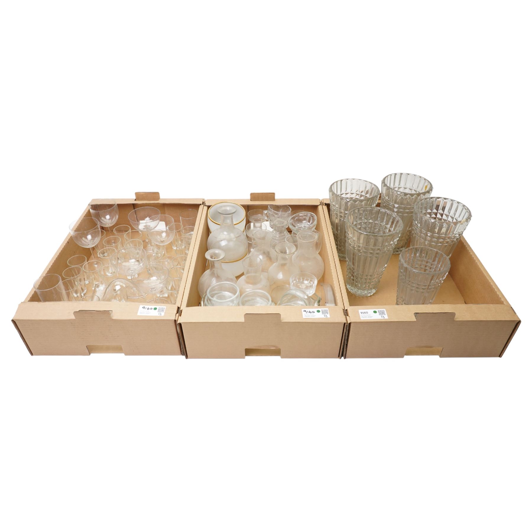 Five ribbed glass vases, glass carafes, pair of Dartington candlesticks and other glass