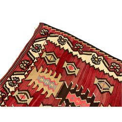 Large  red ground Kilim rug or wall hanging, decorated with geometric patterns and dated within the weave '1969'