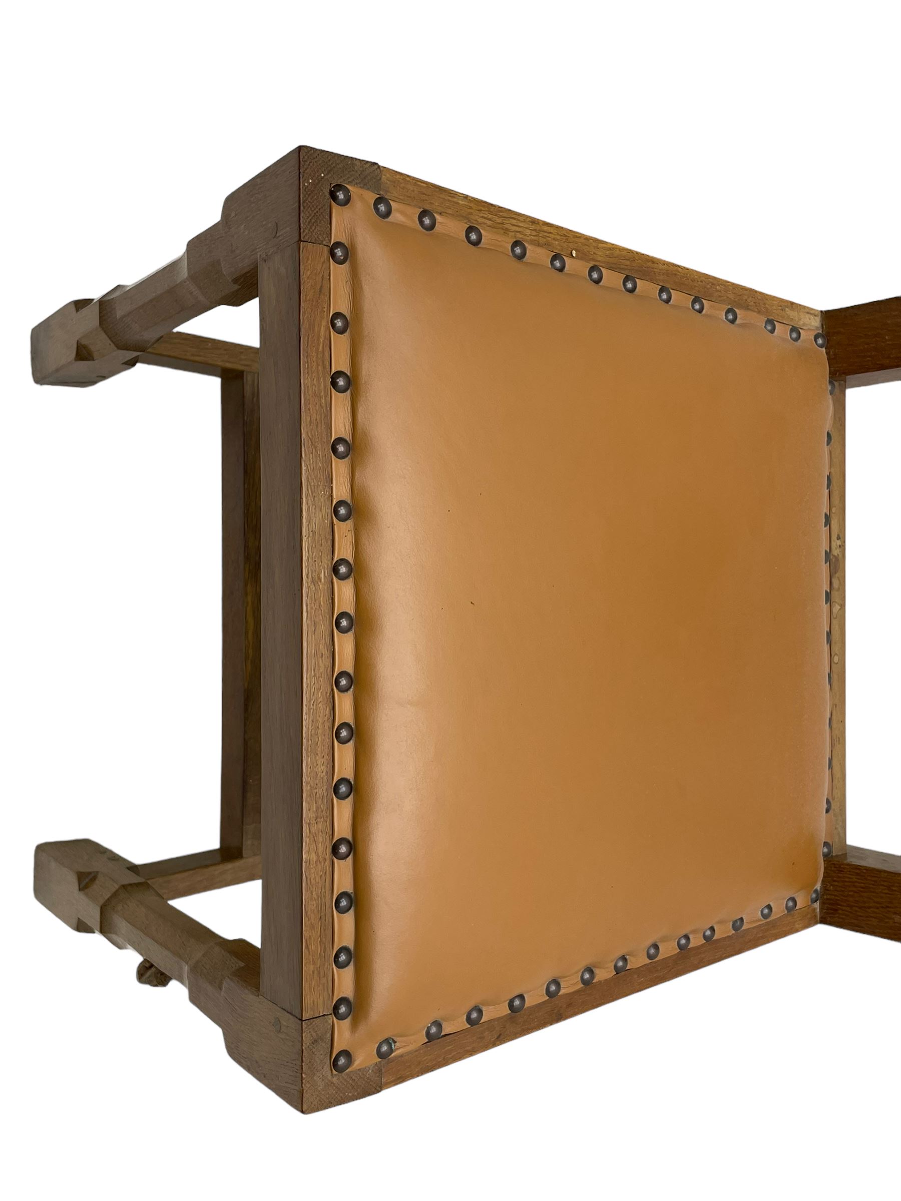 Rabbitman - set of six (4+2) oak dining chairs, carved and pierced lattice back, tan leather upholstered seat with stud band, on octagonal supports united by H-stretchers, carved with rabbit signature, by Peter Heap, Wetwang 