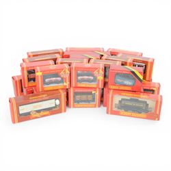 Thrity-two Hornby 00 gauge goods wagons and coaches, including tank, four wheel coaches, c...