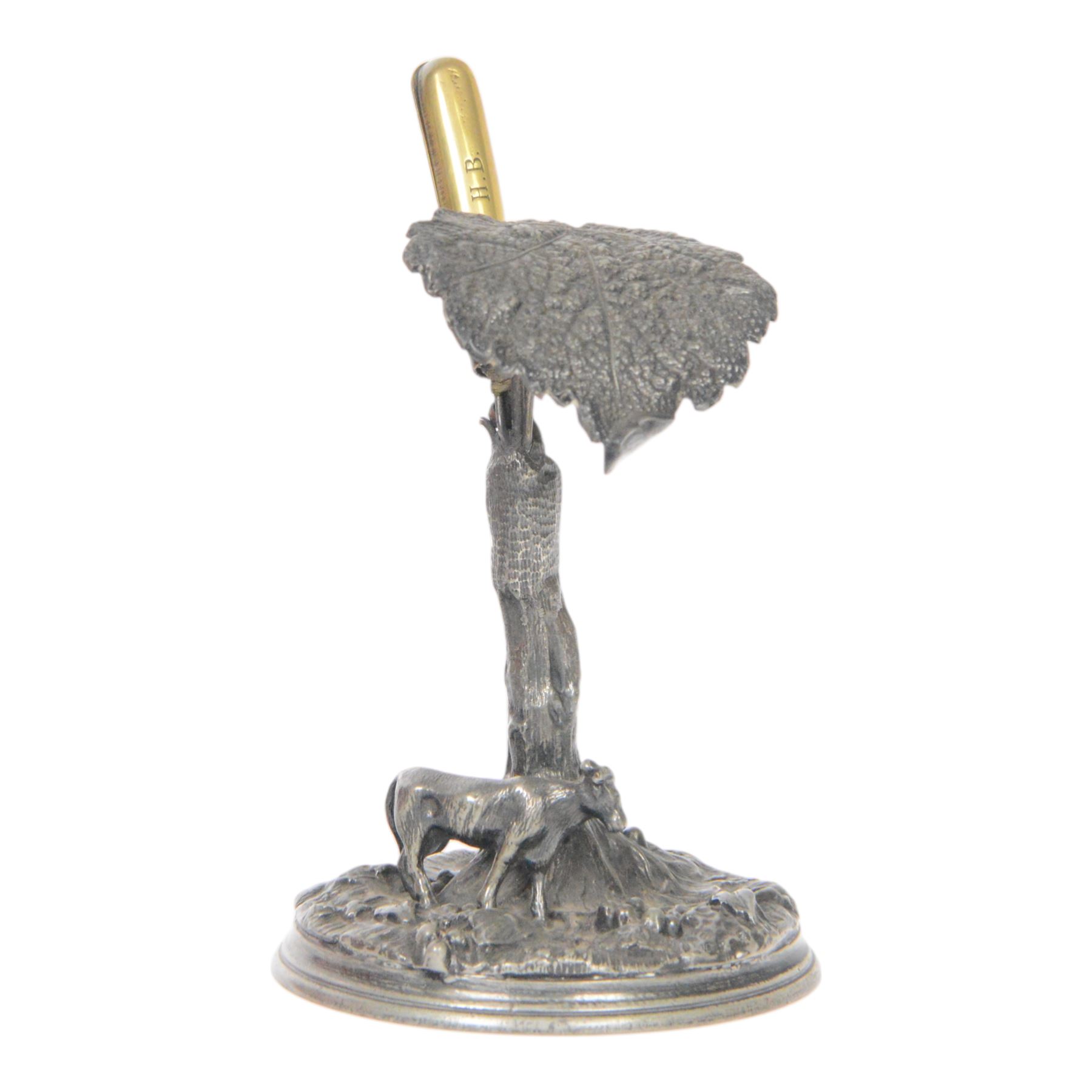 19th century silver plated desk holder, the circular naturalistically modelled base cast with fruiting vines and with applied figure of a ram, rising to a vine with two leaves, and initialled brass clip, H18cm