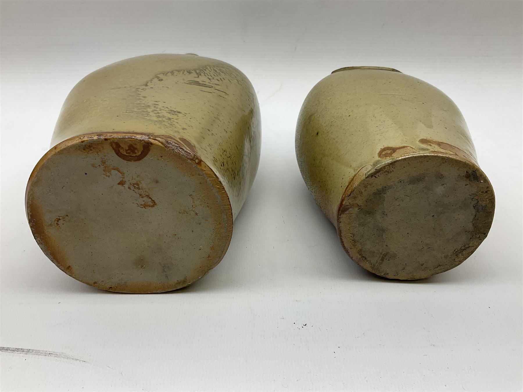  19th century salt glazed stoneware gin bottle impressed John Shaw, Red Lion Vaults, Whitefriargate, Hull of bulbous oval form H27cm and another with impressed label for J. Christie Mytongate Hull (2)  