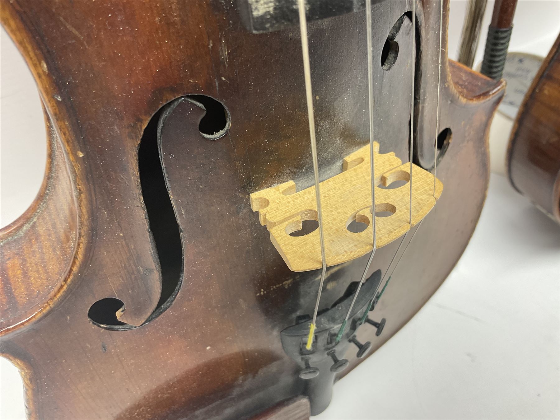 German trade violin in the Steiner style c1900 with 35.5cm two-piece maple back and ribs and spruce top L59cm overall; in fitted carrying case with two bows; and a Saxony violin with 35.5cm one-piece maple back and ribs and spruce top L58.5cm overall (2)
