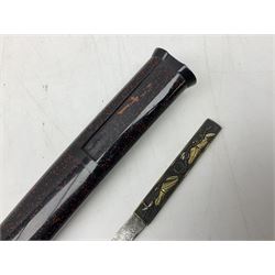 Japanese Tanto with 28.5cm steel blade and cord bound grip; in red spotted black lacquer saya containing a kogai knife with etched characters to the blade and ornate fern leaf and snake handle