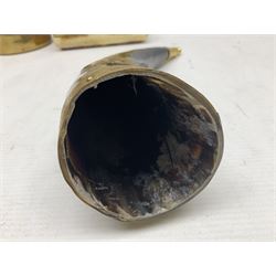 Swiss mountain hunters tobacco pipe with a horn mouthpiece, metal hinged pierced lid and brass chain, the black coated body adorned with small metal cow flowers, together with two other pipes and case, brass mounted horn, brass mounted bone box, carved mother of pearl handled knife and fork and brass jug