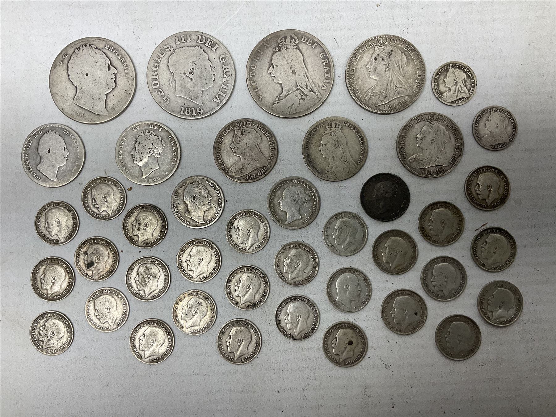 Approximately 120 grams of Great British pre 1920 silver coins, including George III 1819 half crown, William IIII 1834 shilling, Queen Victoria 1892 half crown, various silver threepence pieces etc