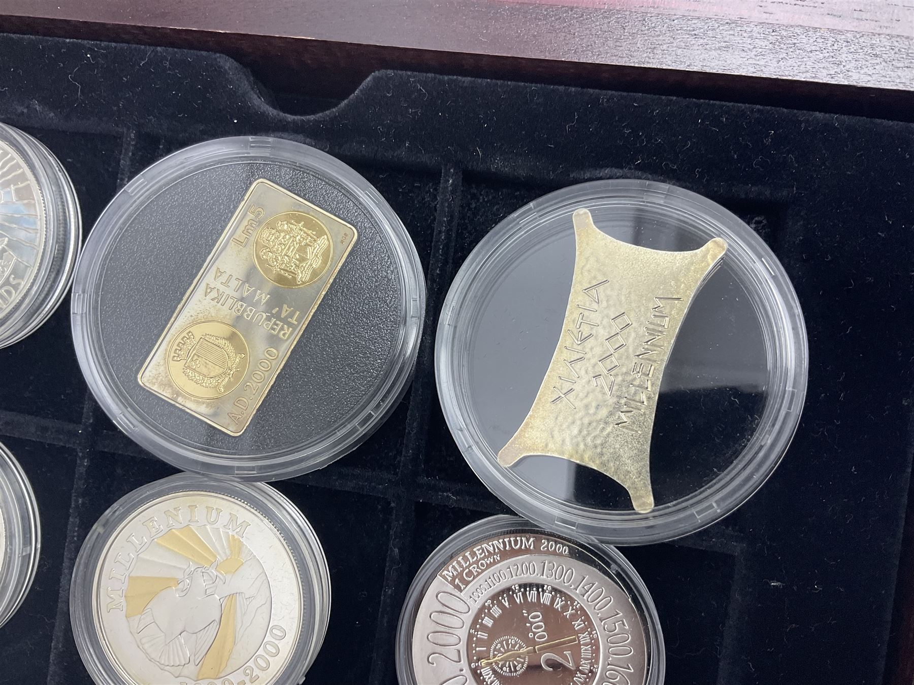 Single owner lifetime collection of mostly commemorative modern World coins with gold, silver and base metal examples, including two Queen Elizabeth II Bailiwick of Guernsey twenty-five pound gold coins 'The 1999 Royal Wedding' and '100th Anniversary of the End of the Victorian Era' 2001 each in 24 carat gold weighing 7.81 grams with certificates, silver coins commemorating the Millennium 2000 including Guyana sterling silver proof two-thousand dollars, Fiji sterling silver proof five dollars etc, silver coins from the Queen Elizabeth II Golden Jubilee Collection dated either 2002 or 2003 from Great Britain and the Commonwealth countries, United Kingdom commemorative crowns in card folders, The Royal Mint United Kingdom 1997 proof coin set in red folder without certificate etc