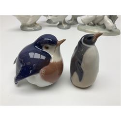 Two Royal Copenhagen figures, comprising robin and penguin, together Royal Copenhagen trinket dishes and Nao and Lladro figures 