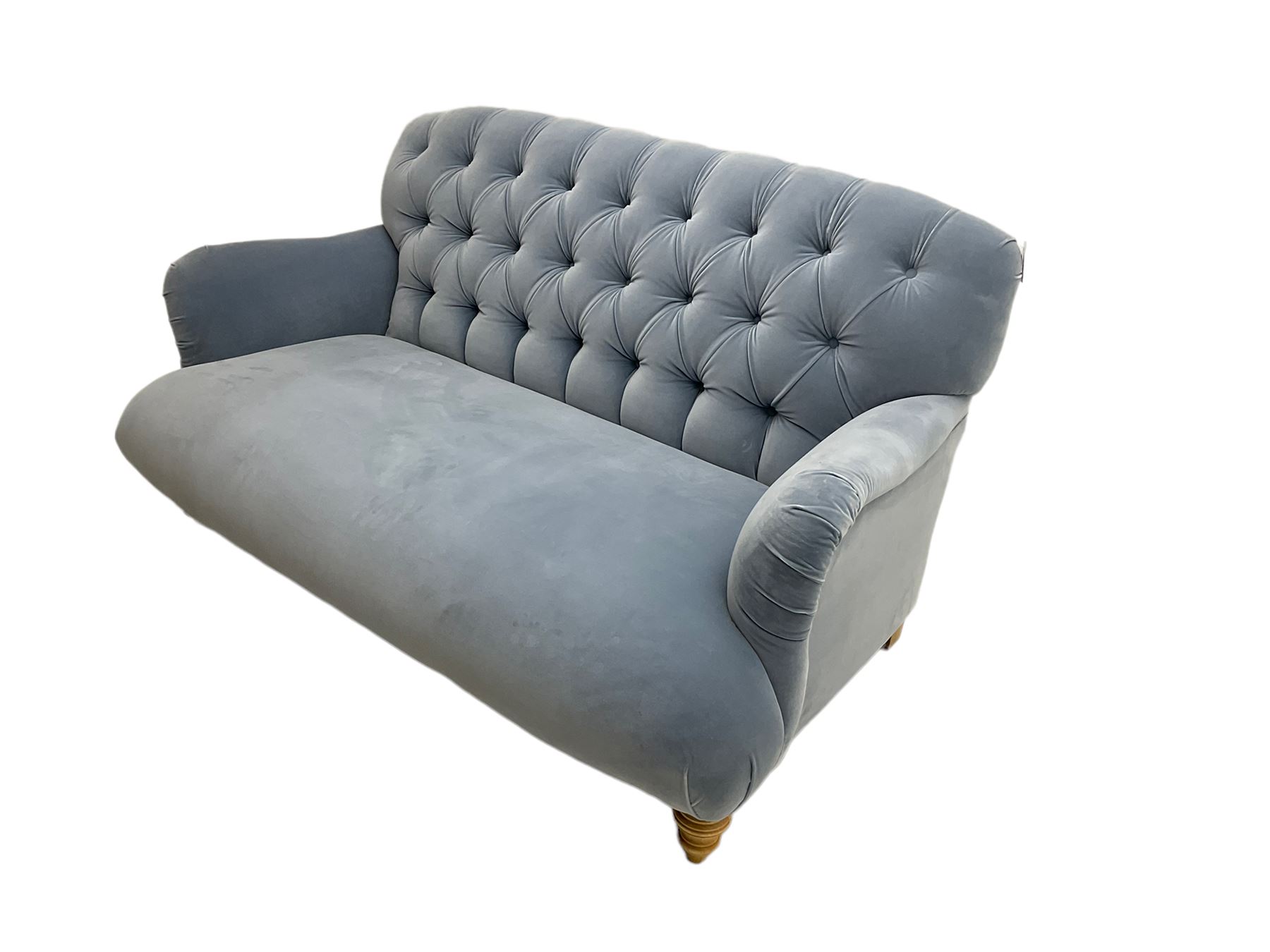 Tetrad two seat sofa upholstered in baby blue buttoned fabric, on