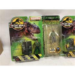 Fourteen carded action figures comprising Toy Story, X-Men Marvel Legends, Lord of the Rings, The Lost World Jurassic Park (2), The Secret Saturdays, Wallace & Gromit, Corgi Tom & Jerry (4), Flintstones, Lost in Space and Disney Infinity Cars; all in unopened blister packs; together with two boxed Robocop figures and carded James Bond car (17)