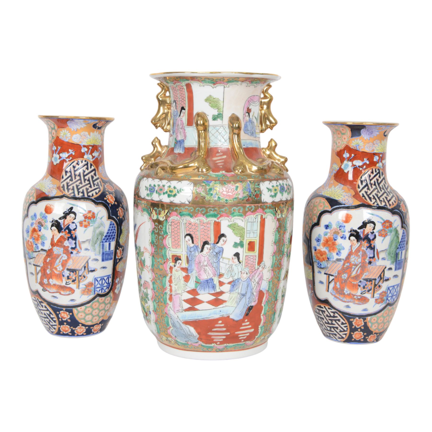 Pair of Japaneses imari vases, the central panel, decorated with figures in a landscape, together with famille rose vase, largest H37cm  