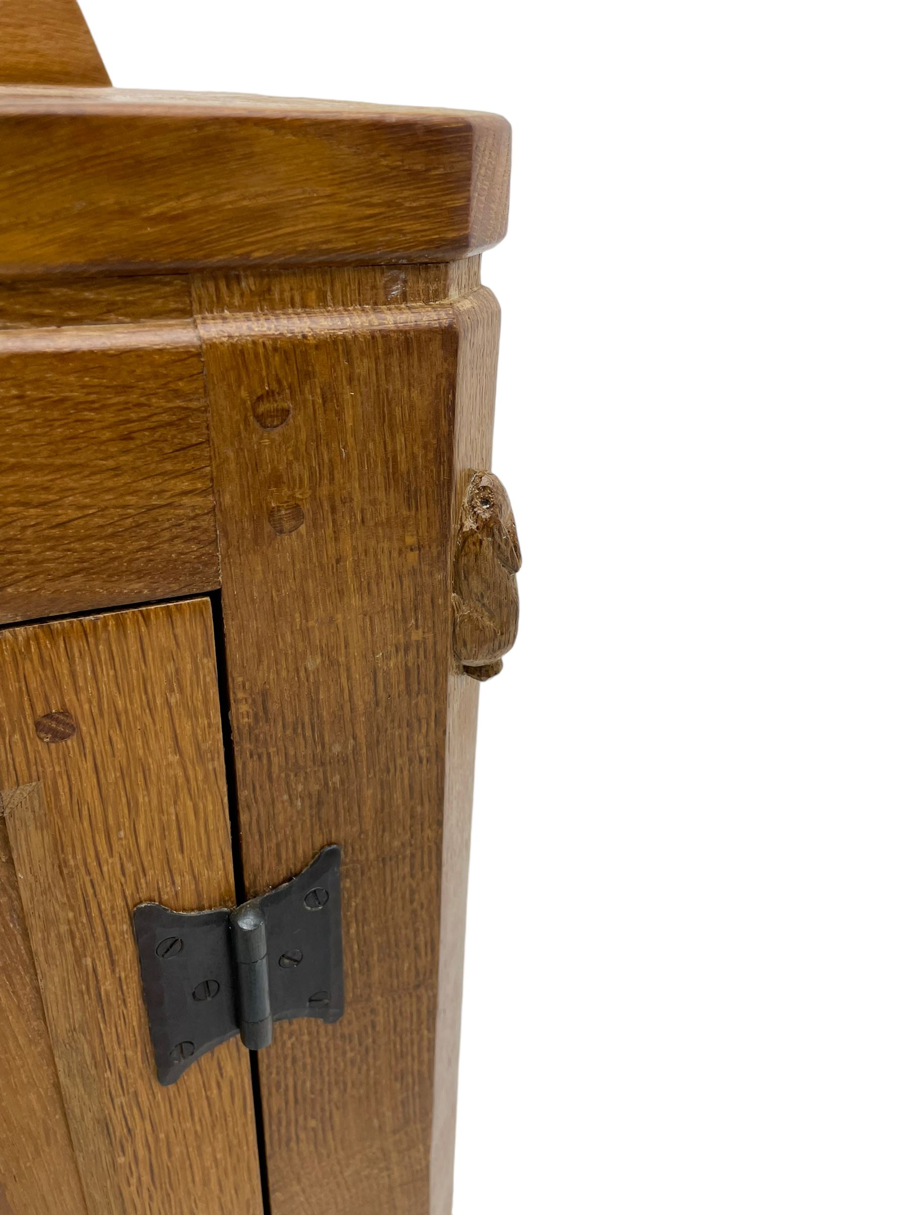 Rabbitman - adzed oak sideboard, fitted with three central drawer and two flanking cupboards, panelled doors with iron latches and hinges, carved with rabbit signature, by Peter Heap, Wetwang