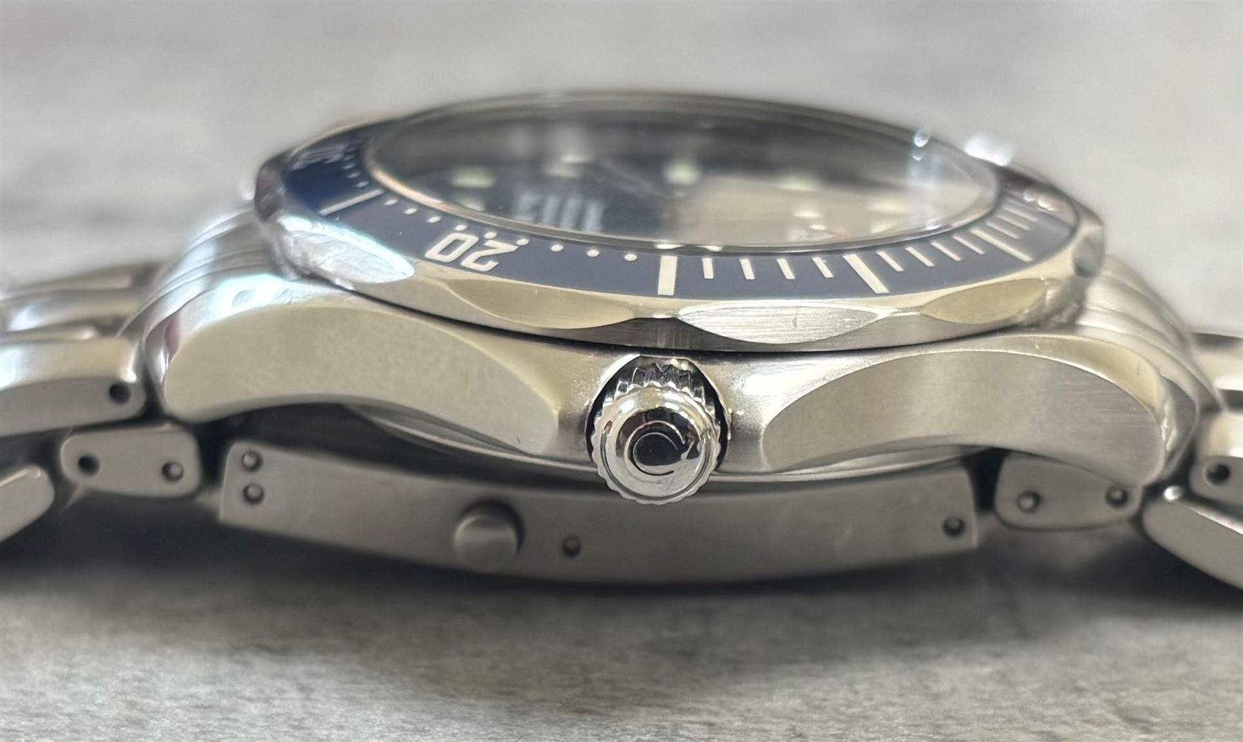 Omega Seamaster gentleman's stainless steel automatic chronometer wristwatch, Ref. 168.1623, Cal. 1120, blue wave dial, with luminous dot and baton hour markers with date aperture, unidirectional rotating blue bezel, on Omega stainless steel bracelet, with fold-over clasp, boxed