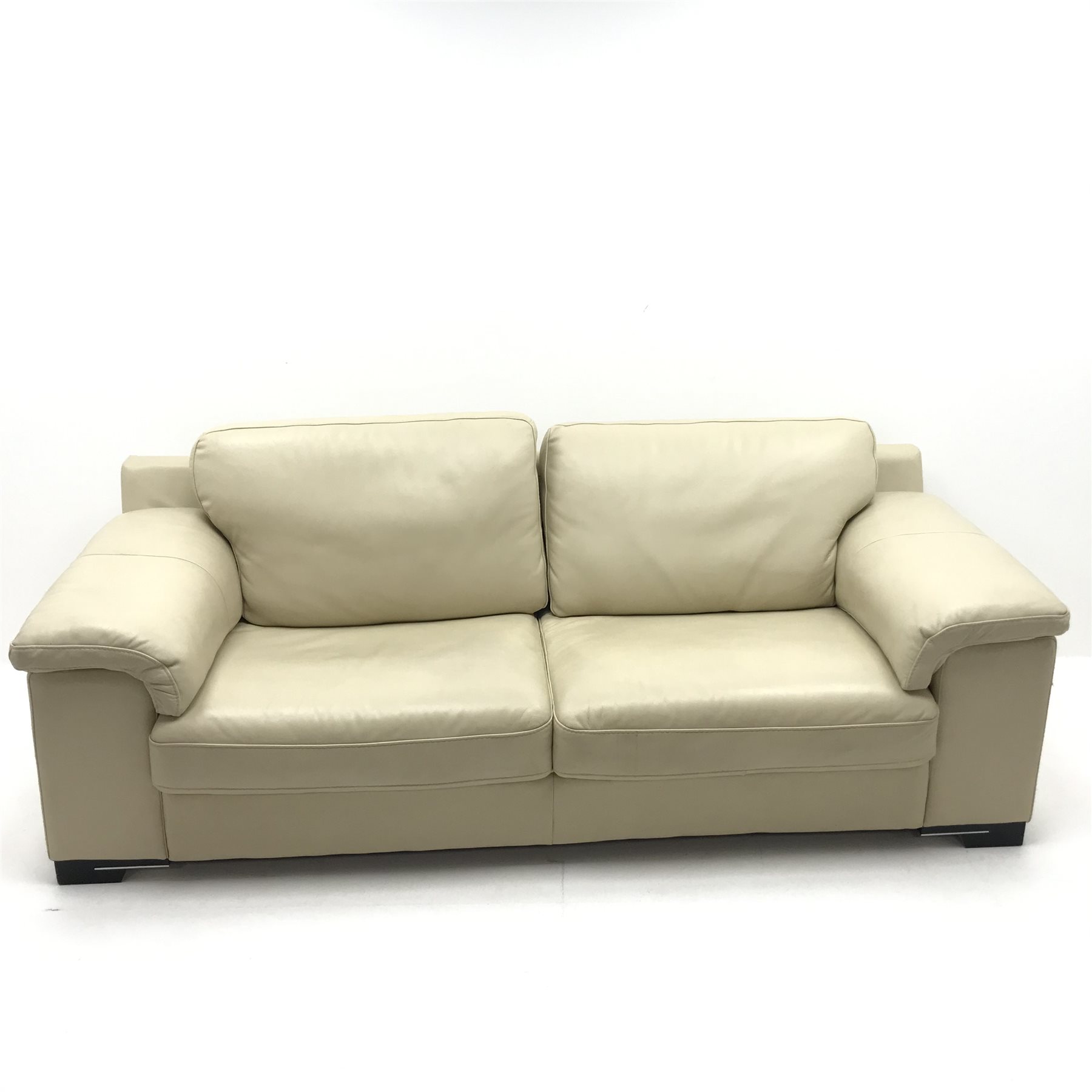 Violino three seat sofa upholstered in cream leather, W222cm The