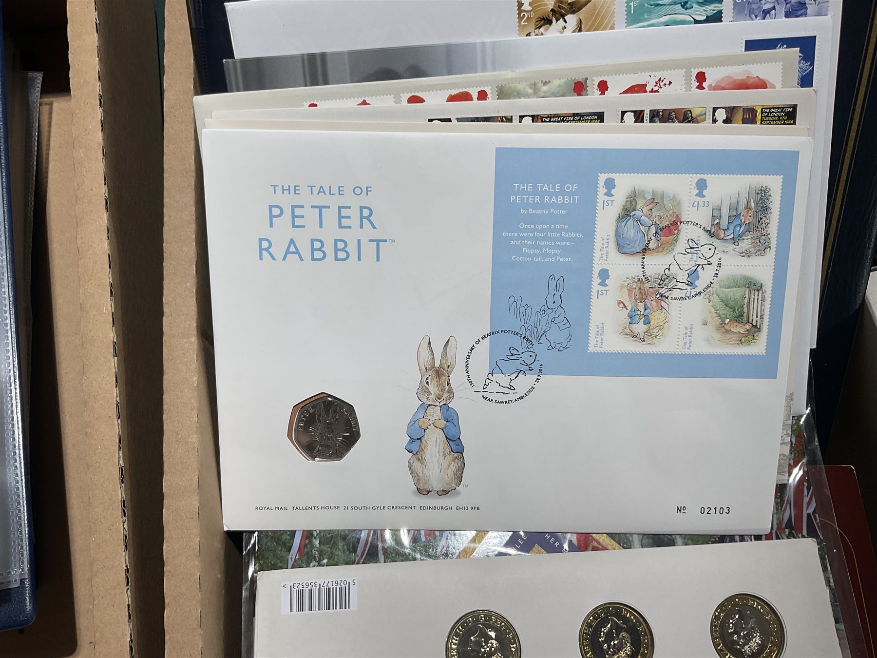 Approximately one hundred and fifteen Royal Mint coin covers, in two ring binder folders and loose, together with approximately 53 grams of Great British pre-1920 and approximately 68 grams of Great British pre-1947 silver threepence coins, and a small quantity of further pre-decimal coins