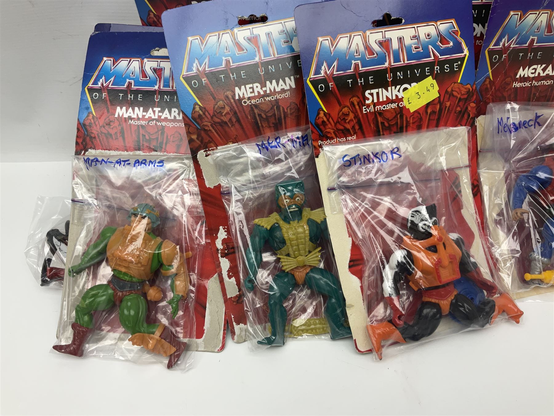 Thirty-one Masters of the Universe He-Man figures re-bagged on original backing cards;  two others lacking backing cards; boxed Modulok figure; bag of weapons and accessories; Roton, two horses and two battle cats; 1986 & 1987 Annuals; Ladybird and other story books; Panini sticker album; instructions etc