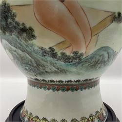 Chinese famille verte vase, of baluster form with fluted rim, the body decorated with five nude female figures amongst water and trees, with bands of polychrome foliate and floral decoration to base and rim, with six character Qianlong mark beneath, upon a circular wooden base, H41.5cm