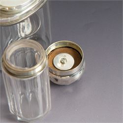 Edwardian tortoiseshell page turner with silver handle, hallmarked Birmingham 1906, maker's mark worn and indistinct, together with a pair of Edwardian silver mounted horsehair brushes engraved with monogram, and two faceted glass jars with silver lids and applied initial N to covers, all hallmarked 