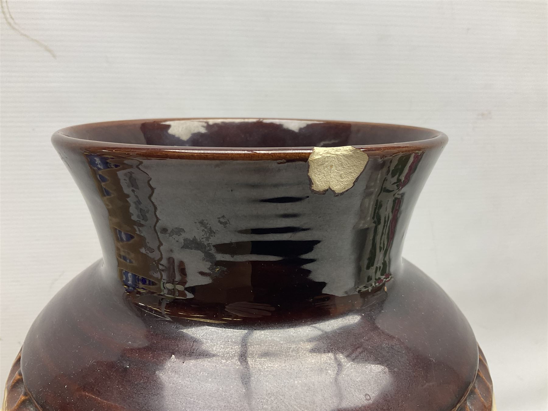 Pair of Bay West German vases, with bold moulded flower and foliage decoration in green, orange and ochre on brown ground, largest H40cm