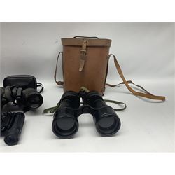 Pair of British World War Two issue black-painted binoculars, Bino 7x50 No. 5, 6E/320, No. 87412, MoD.B/42, with case, together with Nipole 10 x 50 binoculars and two other pairs