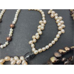 Six fresh water pearl necklaces, including a long brown tone example, and two fresh water pearl three row bracelets