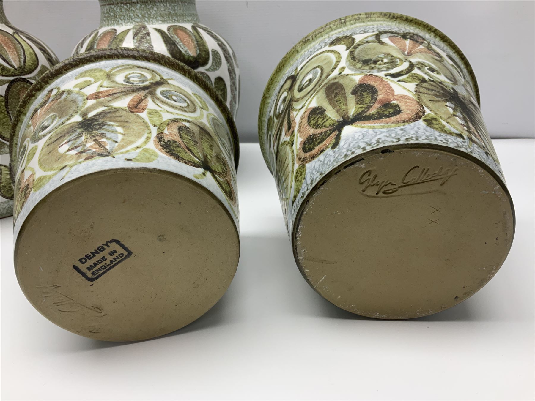 Pair of Denby Glyn Colledge stoneware vases of baluster form with floral decoration over cream ground, together two jardiniere in a similar design, vases H24cm