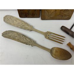 Two wooden biscuit moulds, carved loving spoon and fork, and two bradawls 