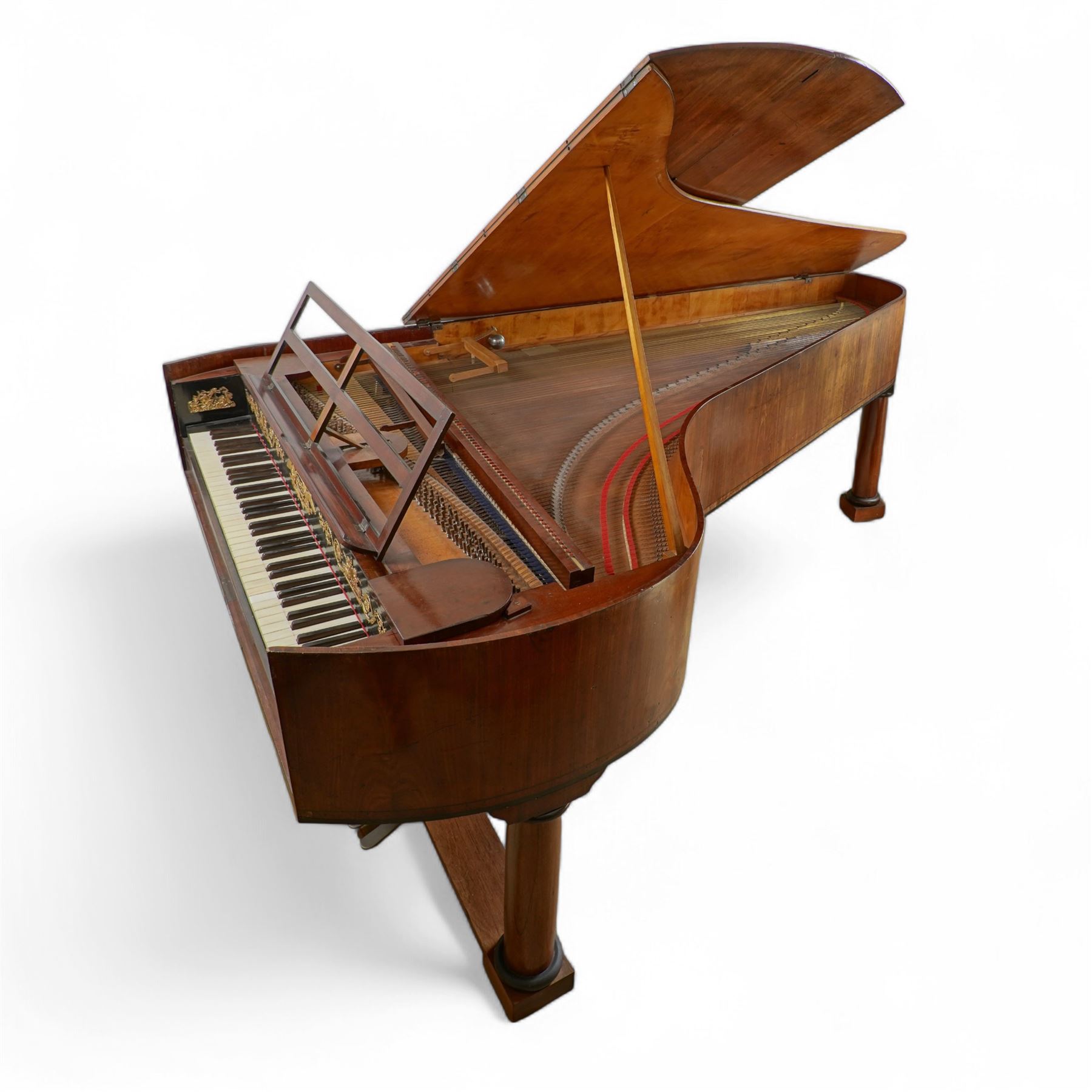 Austrian “Viennese” Grand Piano by Joseph Böhm c1820.
Straight triple strung, with a Viennese action and adjustable escapement rail, some new dampers and damper felt with leather covered hammers, string gauges marked on the wrest plank, soundboard appears to have been shimmed in places, bridge in good condition, possibly re-strung at some time with one tuning pin and two strings missing. Action with good repetition and damping, however some adjustment may be necessary to both the action and pedals. Six octave keyboard, with 78 keys C1-F7, with Ivory naturals and ebony sharps, lyre supported on a stretcher with seven pedals, Bells & Drum, Treble Sustain, Full Sustain, Piano & Pianissimo, Bassoon Stop and Una Corda. Adjustable open lattice music desk. Ebonised panel above the keys with maker name and decorative gilt mounts depicting imperial eagles, grapevines, scrollwork, and angelic trumpeters. Case raised on three circular columns with block supports. 
This instrument is typical of the type of piano being made in Vienna in the early 19th century and a type of piano possibly familiar to Beethoven during the period of the composers’ later compositions. This piano is thought to be one of the earliest known pianos by this maker and was discovered in Milan in the 1870’s. A retailer’s trade label from that period is attached to the soundboard.

Given the intricate nature of these historic instruments, specialist support will be available if required, to assist successful buyers with safe removal and onward handling. Price upon application. 

This item has been registered for sale under section 10 of the APHA Ivory Act Reference A2ZEXJGY