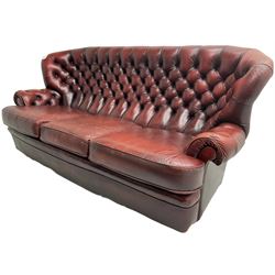 Wade - Georgian design three-seat sofa, high curved back over scrolled arms, upholstered in deep buttoned oxblood 'Pegasus' leather, on castors