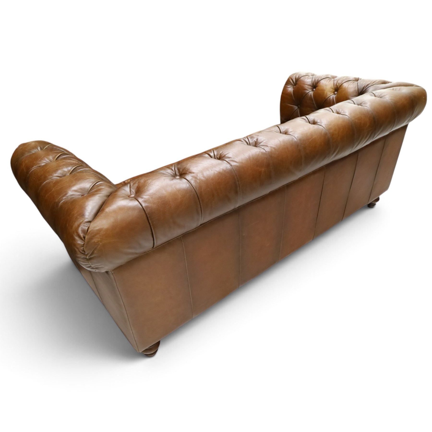 Barker and Stonehouse - traditional shape 'Ullswater' three seater Chesterfield club sofa, rolled back and arms upholstered in buttoned tan leather with studwork, raised on turned feet