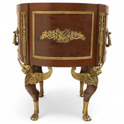 An imposing and richly adorned Empire Revival jardiniere of circular form, decorated with finely cast gilt bronze laurel garlands and floral swags, interior with a modern brass liner, sides with gilt bronze carrying handles, raised on three tripod legs with classical caryatid masks with wings terminating in lion paw feet, circa 1900

Provenance: This jardiniere formed part of the original furnishings of the opulent Empire Room at Kinloch Castle, built by industrialist George Bullough in 1900.

An original inventory number, ‘X954’, is inscribed on one facing, verifying its presence in the Kinloch Castle collection. This jardiniere epitomises the lavish taste of the Edwardian elite and the high standards of craftsmanship employed in the furnishing of Kinloch Castle, the first private home in Scotland to be lit by electricity and famed for its extravagant interiors.


