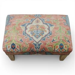 Pair of needlepoint footstools, retailed by The Bespoke Footstool Co, brass studded trim on tapered oak supports