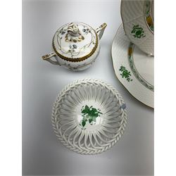 A group of Herend hand painted porcelain, comprising pair of plates with basket weave effect rims, D22.5cm, two small dishes with open work sides, a small jug and cover with flower finial, all decorated with green floral sprays, plus a small twin handled pot and cover or sucrier.