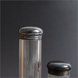 1920s gentleman's travelling case by Mappin & Webb Ltd, tan leather impressed with initials NAO, opening to reveal a compartmentalised interior containing silver mounted dressing table items, including a pair of silver mounted brushes, engraved NAO AMA 1918, hallmarked William Comyns, London 1911, five faceted glass jars and bottles with silver lids and a silver shaving brush holder, all hallmarked Mappin & Webb Ltd, London 1922, tan leather box containing razor, silver plated shoe horn, scissors and bevelled edge shaving mirror with easel support