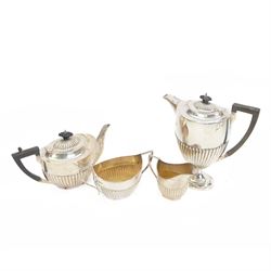 Early 20th century four piece silver tea service, comprising teapot, hot water pot, open s...