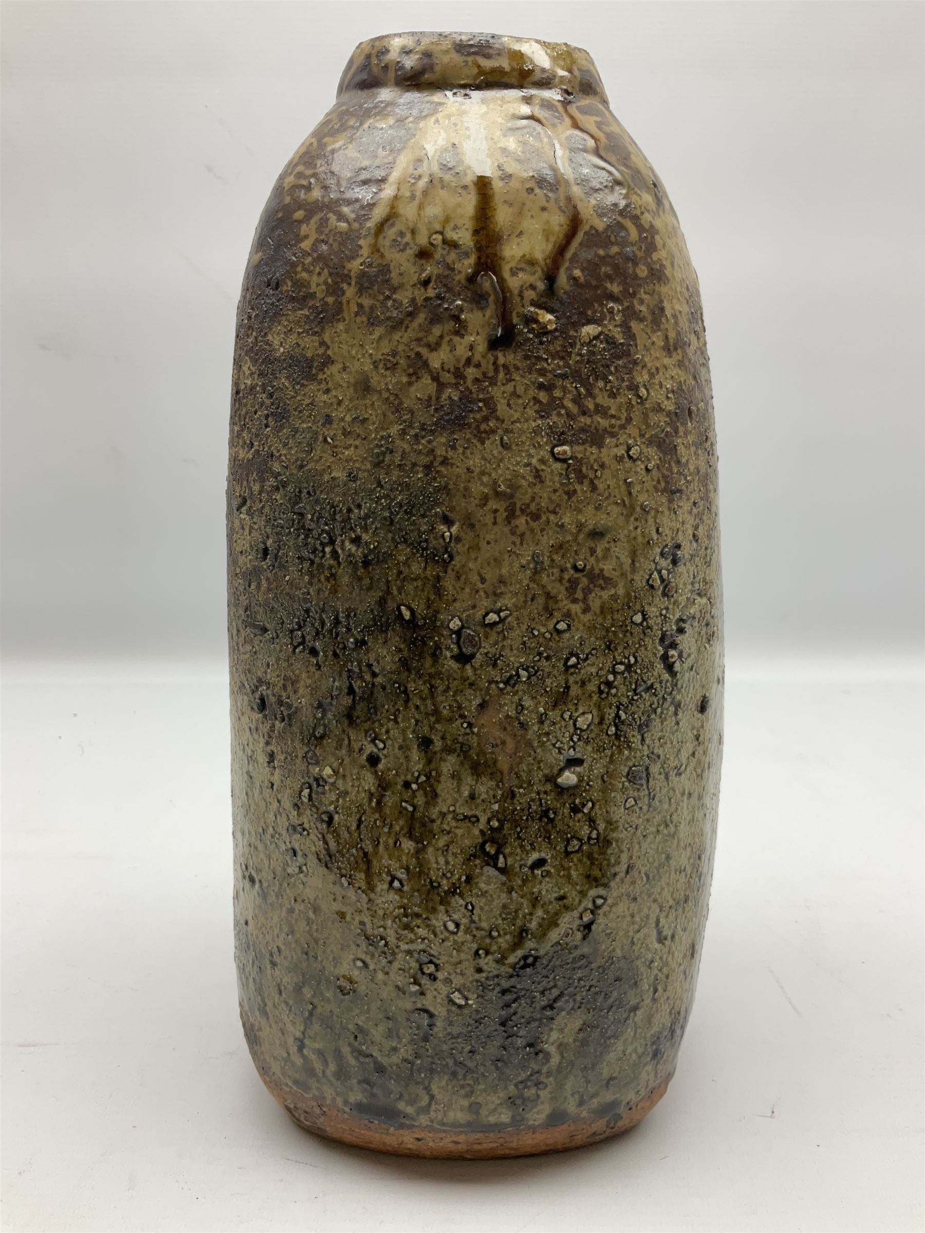 Janet Leach (American, 1918-1997) for Leach Pottery; studio pottery Bizen style vase of tapering form, the stoneware body decorated in a mottled green and brown dripped ash glaze, with impressed J.L. monogram and stamp marks beneath, H30cm