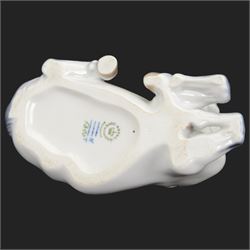 Two Royal Copenhagen figures modelled as Lippizaner horses, the first example in a recumbent pose no 5690, the second example prancing upon a stepped circular base, H19cm 