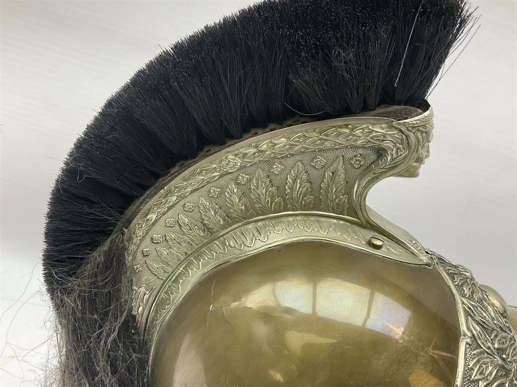 French Model 1913 mounted gendarmerie helmet; brass bodied with nickel mounts, chin strap, comb and horse-hair H27cm (no liner)