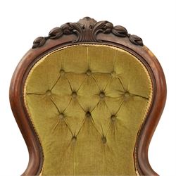Victorian mahogany green upholstered nursing chair, balloon back with carved cresting rail, button back upholstered with low swept arms, raised on cabriole supports
