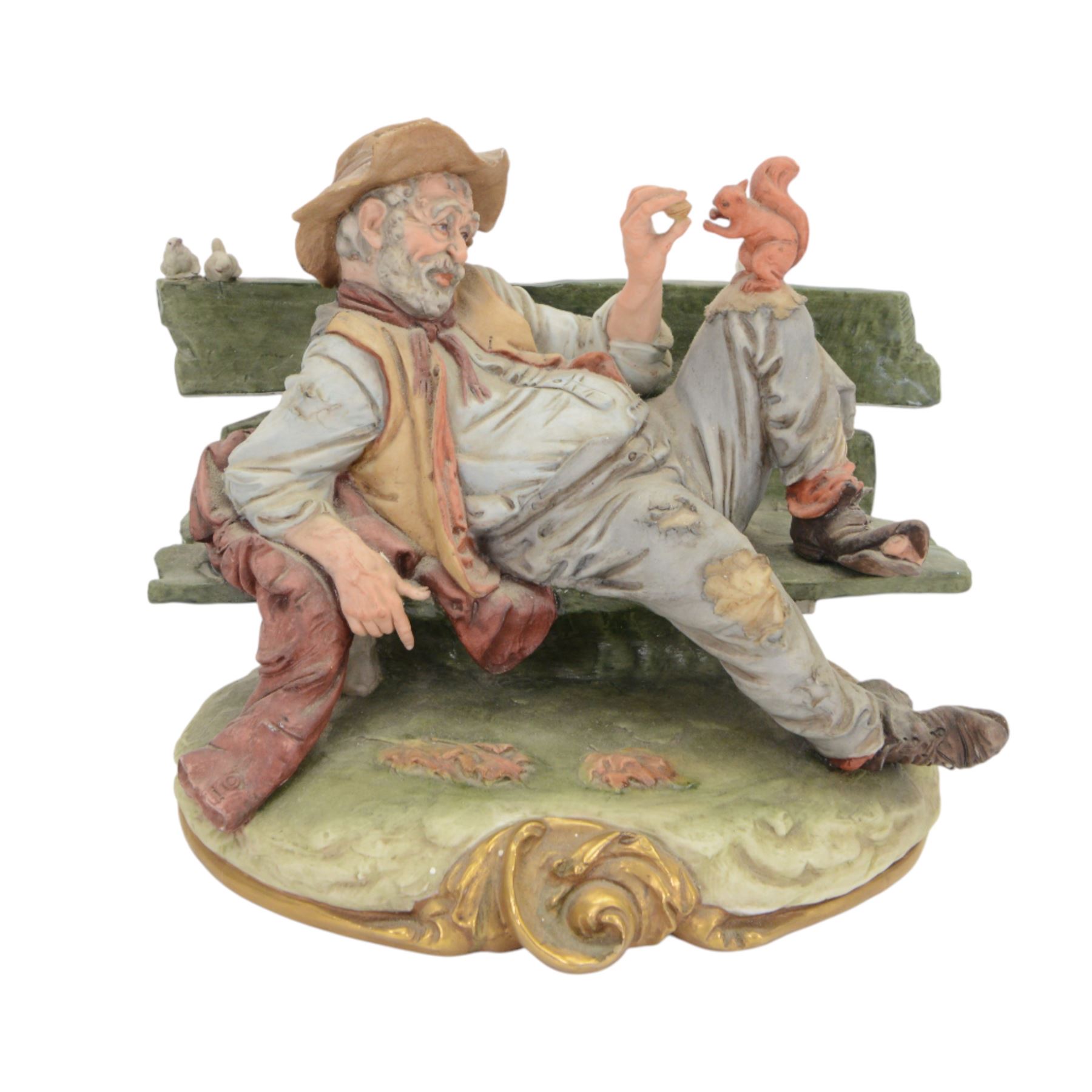 Three Capodimonte figures, including Male artist, Tramp on a Bench, and Boy Fishing, largest H35cm