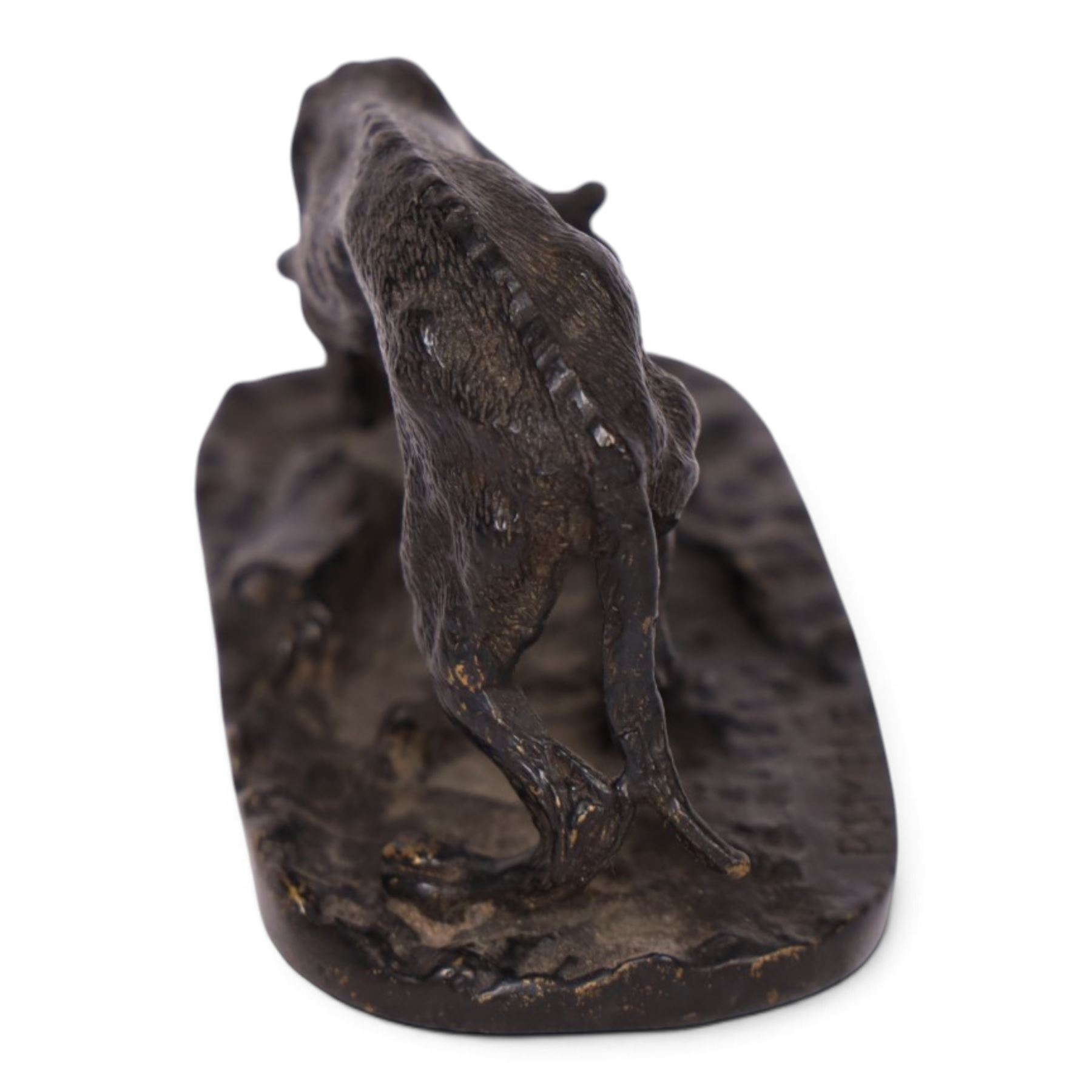 After R J Mene, bronze modelled as a dog with a bone, H5cm, L10cm 